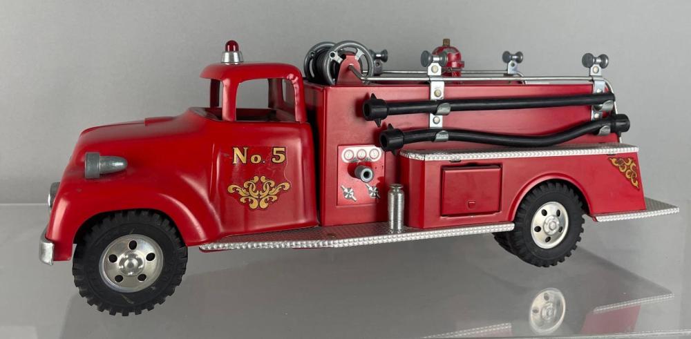 Red vintage toy fire truck with a ladder and side pump detail, labeled “No. 5,” shown on a gray background.