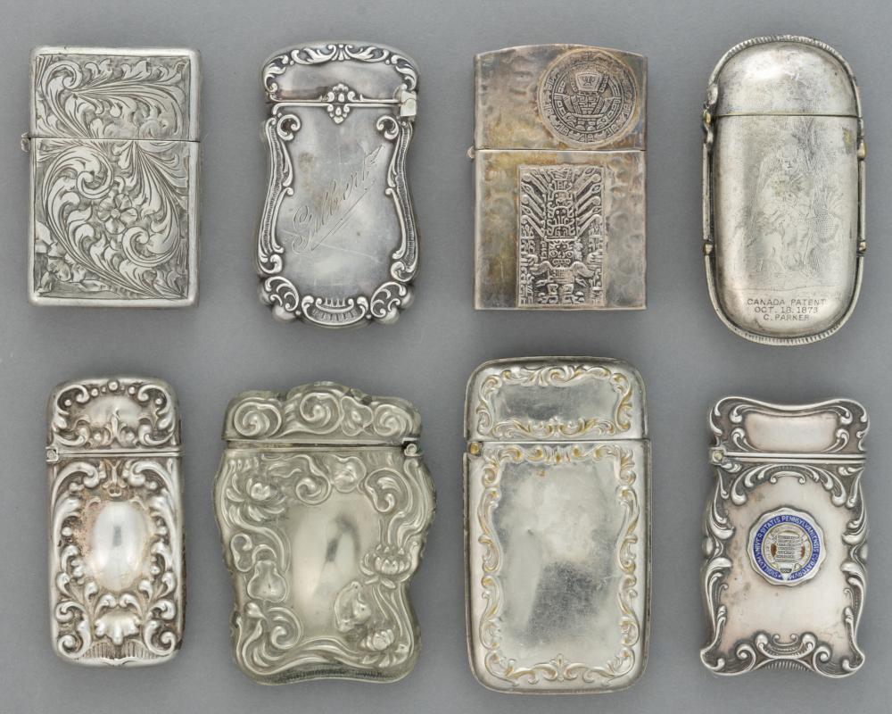 ANTIQUE / VINTAGE STERLING SILVER AND OTHER MATCH SAFES AND LIGHTER COVERS, LOT OF EIGHT sold by Jeffrey S. Evans & Associates, lot 381 — auction record photograph