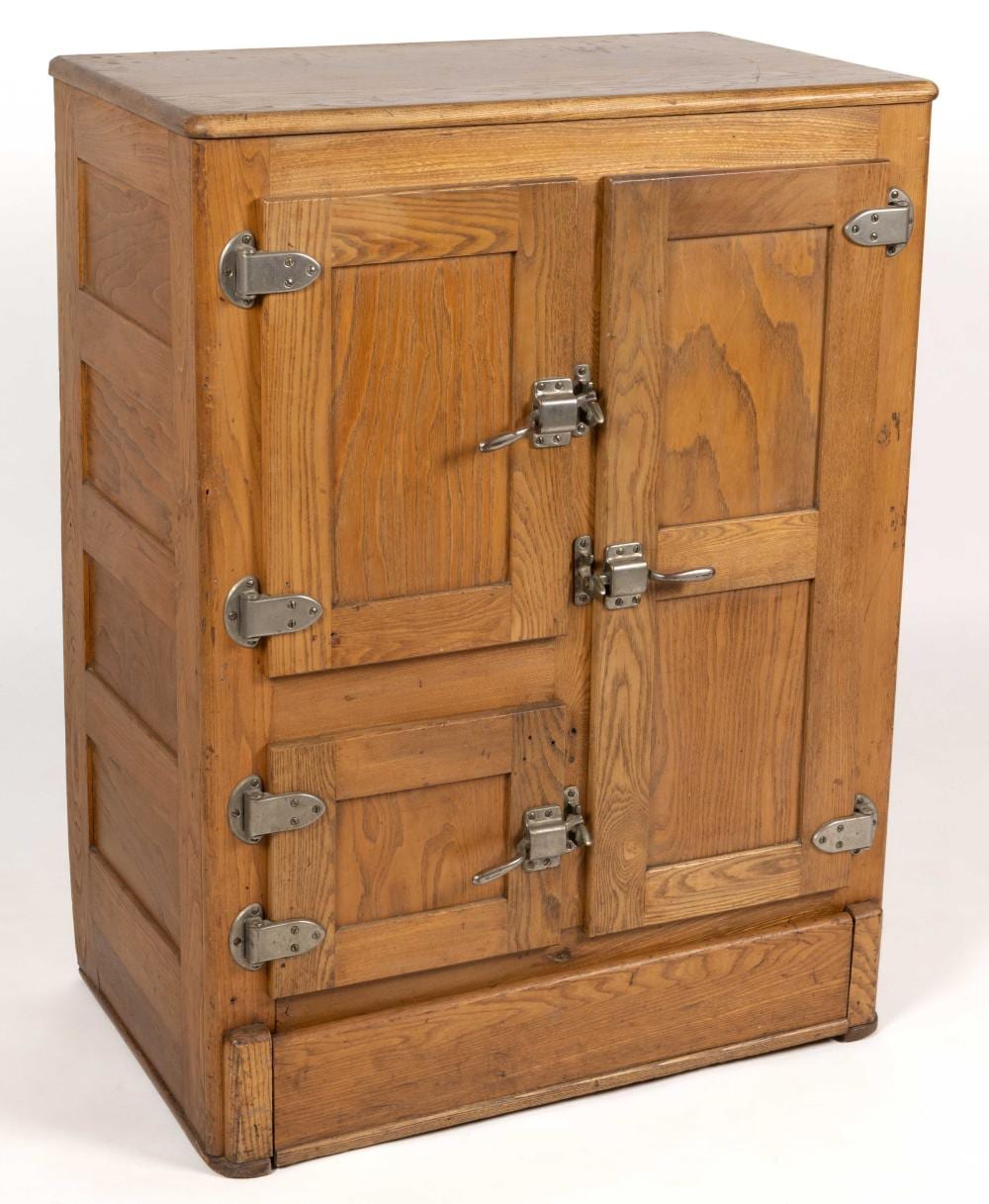 Wooden ice box with hinged double doors and metal latches, shown in front view on a white background.
