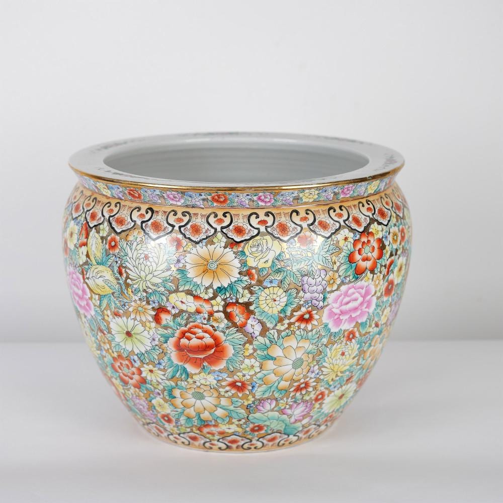 Colorful ceramic fishbowl planter with a wide round opening and painted floral and butterfly decoration around the body.