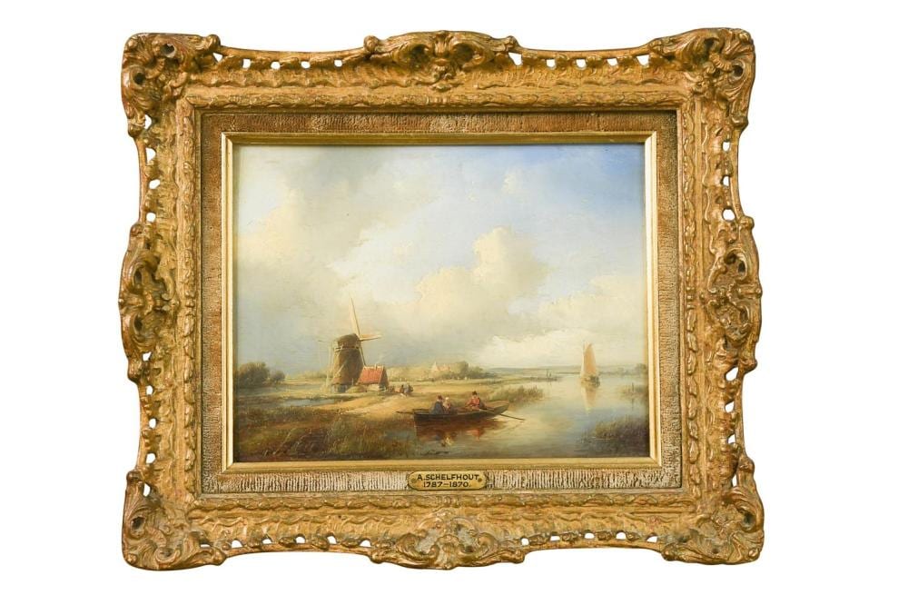 Gilded picture frame enclosing a landscape painting with a windmill, boats on a river, and distant sailboats under a pale sky.