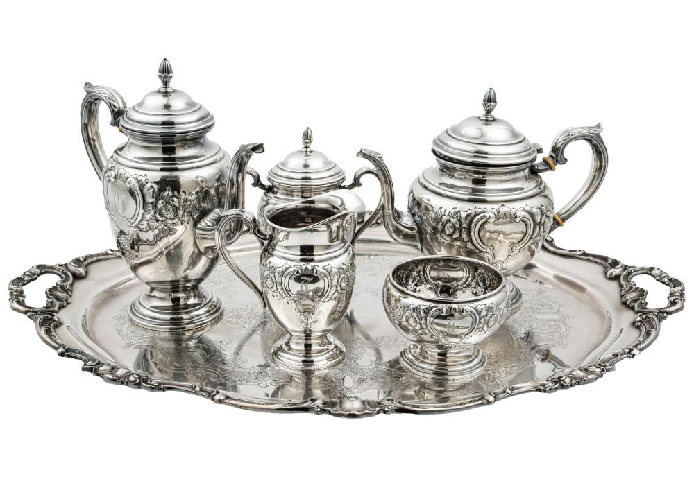 Auction comp thumbnail for American Sterling Silver Coffee and Tea Service,, International, pattern C370C, incl. coffee pot (h. 10 1/4 in.), teapot, covered sugar, creamer and waste bowl; TOGETHER WITH Gorham silverplate tea tray no. YC777 (26 ... (Neal Auction Company, Lot 21)