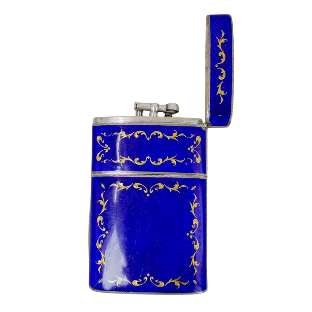Blue and gold enamel cigarette case lighter with ornate scrollwork and a flip top, shown on a white background.