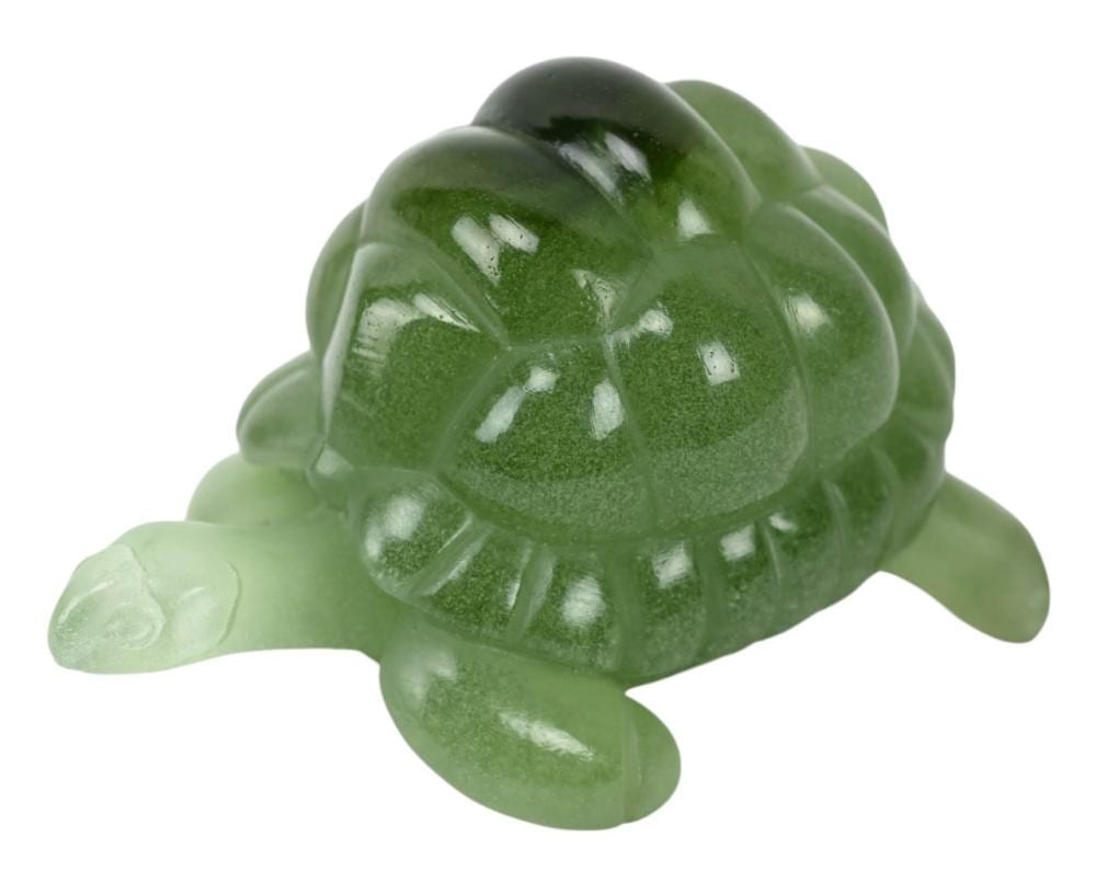 Green glass sea turtle figurine with a glossy shell and flipper details against a white background.