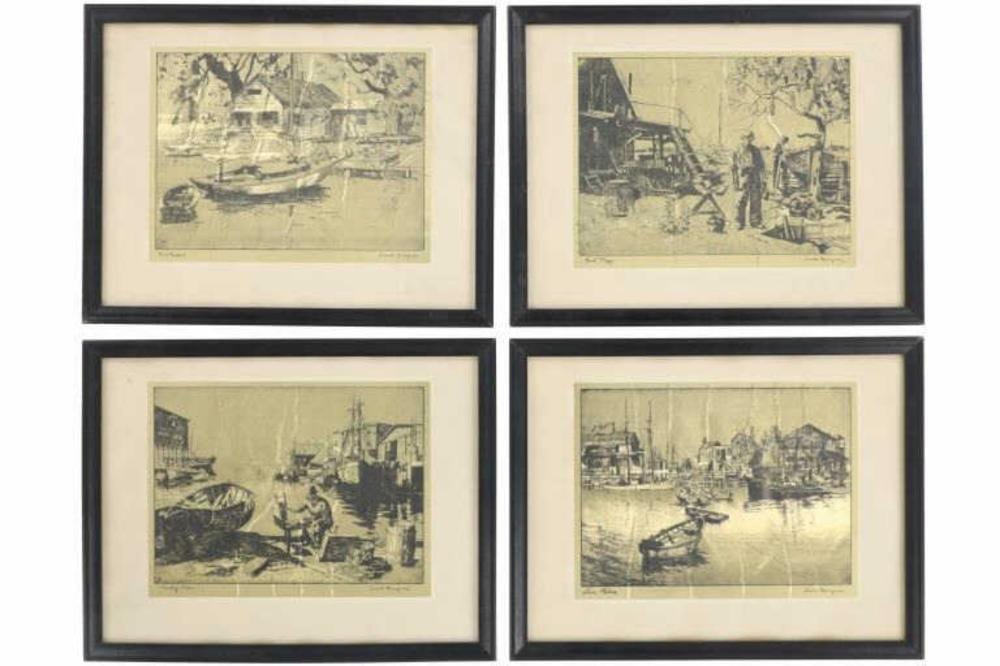 Set of four framed black-and-white etching prints showing harbor scenes with boats and buildings.