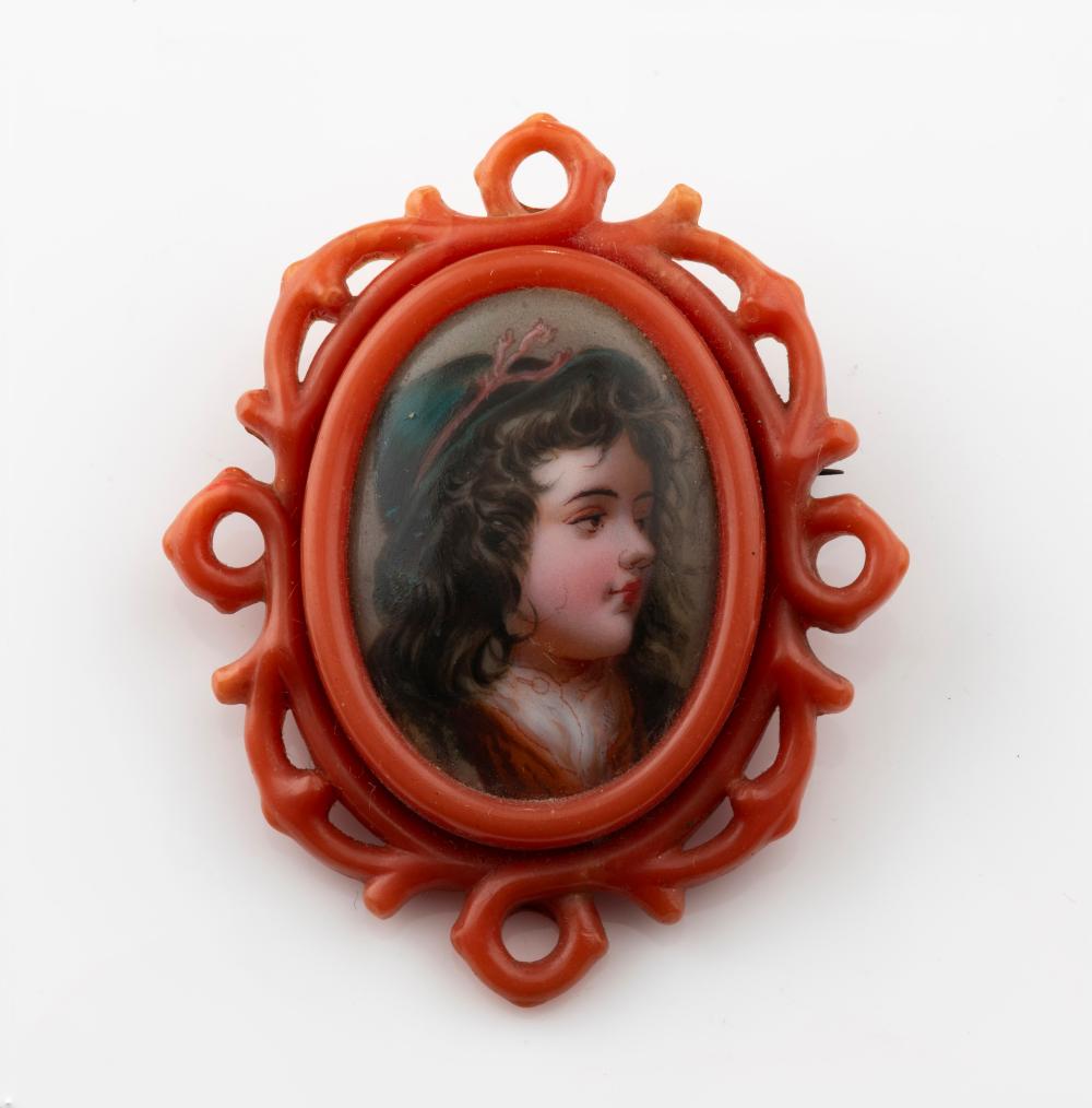 An unusual antique German faux coral mounted mourning brooch with hand-painted miniature portrait and woven hair window on the reverse, 19th century, 5.1cm high sold by Leski Auctions Pty Ltd, lot 316 — auction record photograph