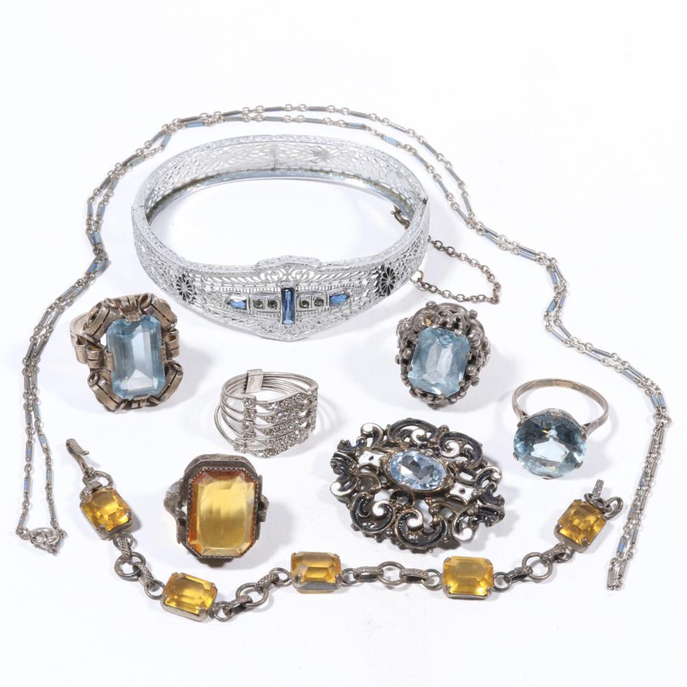 Auction comp thumbnail for Art Deco jewelry group: ice blue glass hallmarked, 9355 rings and sterling brooch, citrine glass sterling ring and 800 silver bracelet, 800 silver rhinestone stacker ring, filigree bracelet with sterling safety chain, an (Ripley Auctions, Lot 209)