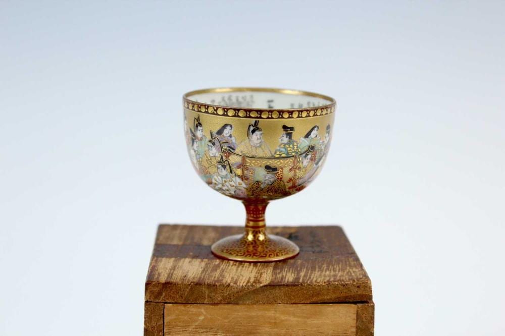 A Japanese Kutani sake cup with micro brush-writings, first half of the 20th century. The exterior delicately portrayed "The Thirty-Six Immortal Poets”, a list of 36 outstanding poets selected by Fujiwara Kintō (966-1041), a court noble in the... sold by Lacy Scott & Knight, lot 2254 — auction record photograph