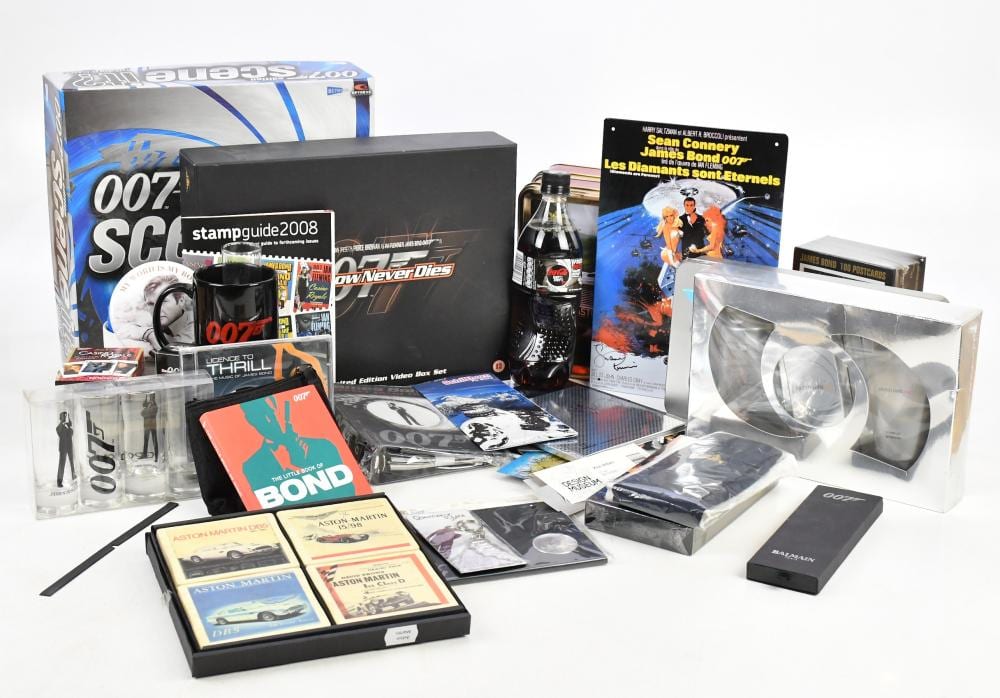 JAMES BOND; a group of modern collectables including playing cards, booklets, DVDs boxes, a bottle of Coke Zero, a large selection of Moonraker Eon Production Trade Cards, other stickers, tins, games, etc (qty). sold by Adam Partridge Auctioneers, lot 1751 — auction record photograph