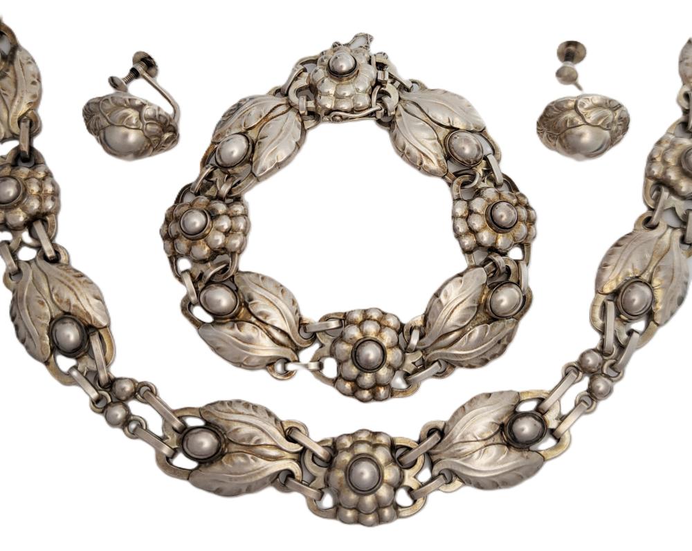 Auction comp thumbnail for Georg Jensen 925 Sterling Silver Necklace Choker Bracelet Earrings Denmark Designer Signed Jewelry Suite (Hess Fine Art, Lot 4670)