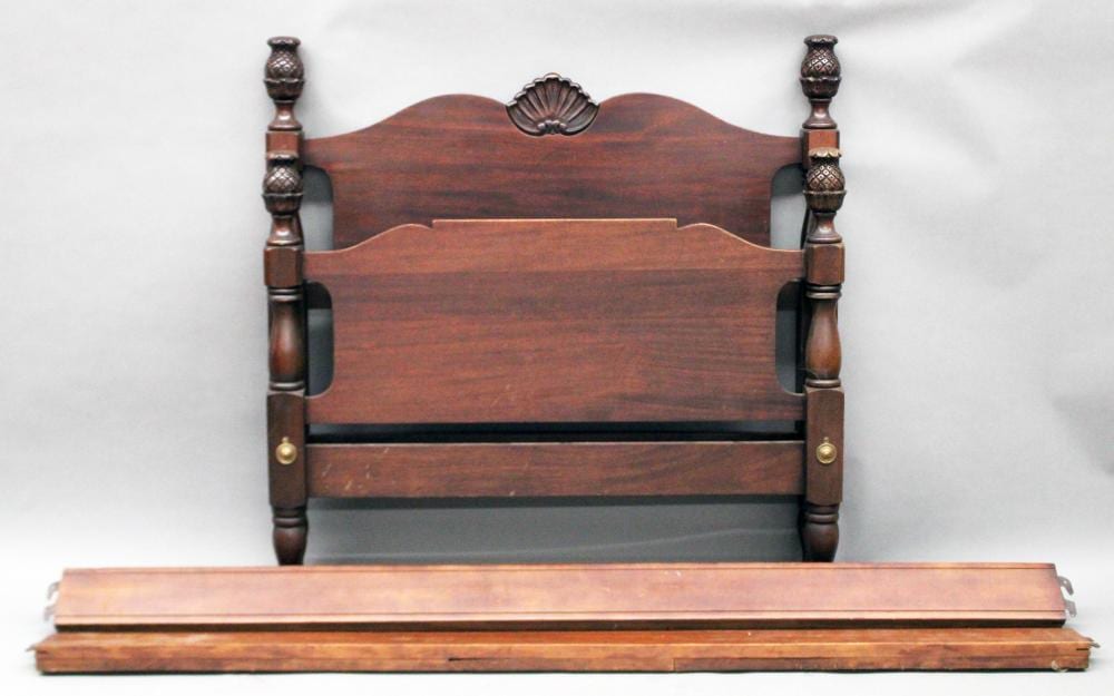 Furniture: NO SHIPPING -Antique mahogany pineapple sturdy, solid twin bed frame with rails; pineapple carved finials/post tops; standard size (Good) NO SHIPPING sold by Roan Inc. Auctioneers & Appraisers, lot 365 — auction record photograph