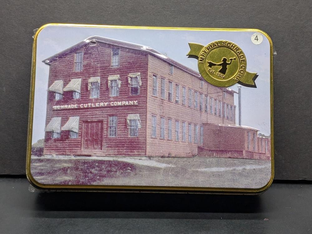 Schrade Building Tin with Old Timer 94OTW Gunstock Trapper 6.9in Traditional Folding Pocket Knife 2 SS Blades, NIP - Unopened sold by Richard L. Edwards Auctioneer, lot 4 — auction record photograph