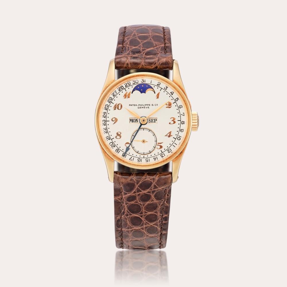 Reference 96 | A unique and historically important yellow gold full calendar wristwatch with moon phases and Breguet numerals, Made in 1937 and sold to Tiffany & Co. in 1940 comparable sale
