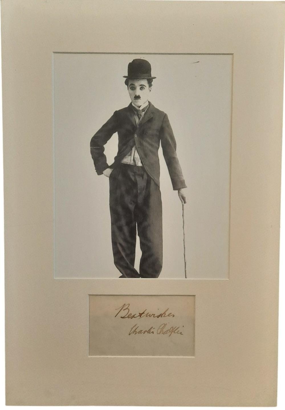 Charles Spencer Chaplin comparable auction result: charlie chaplin 18x12inch mounted signature display includes signed album page and black and white