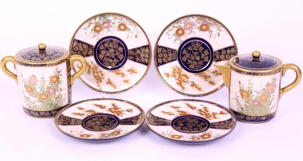 Auction comp thumbnail for A Japanese Satsuma porcelain tea set on royal blue ground, with allover finely hand painted floral and gilt decoration. Consisting of teapot, lidded sugar bowl and saucers. Signed to base. H 10cm D 11cm. (Christian McCann Auctions, Lot 92)