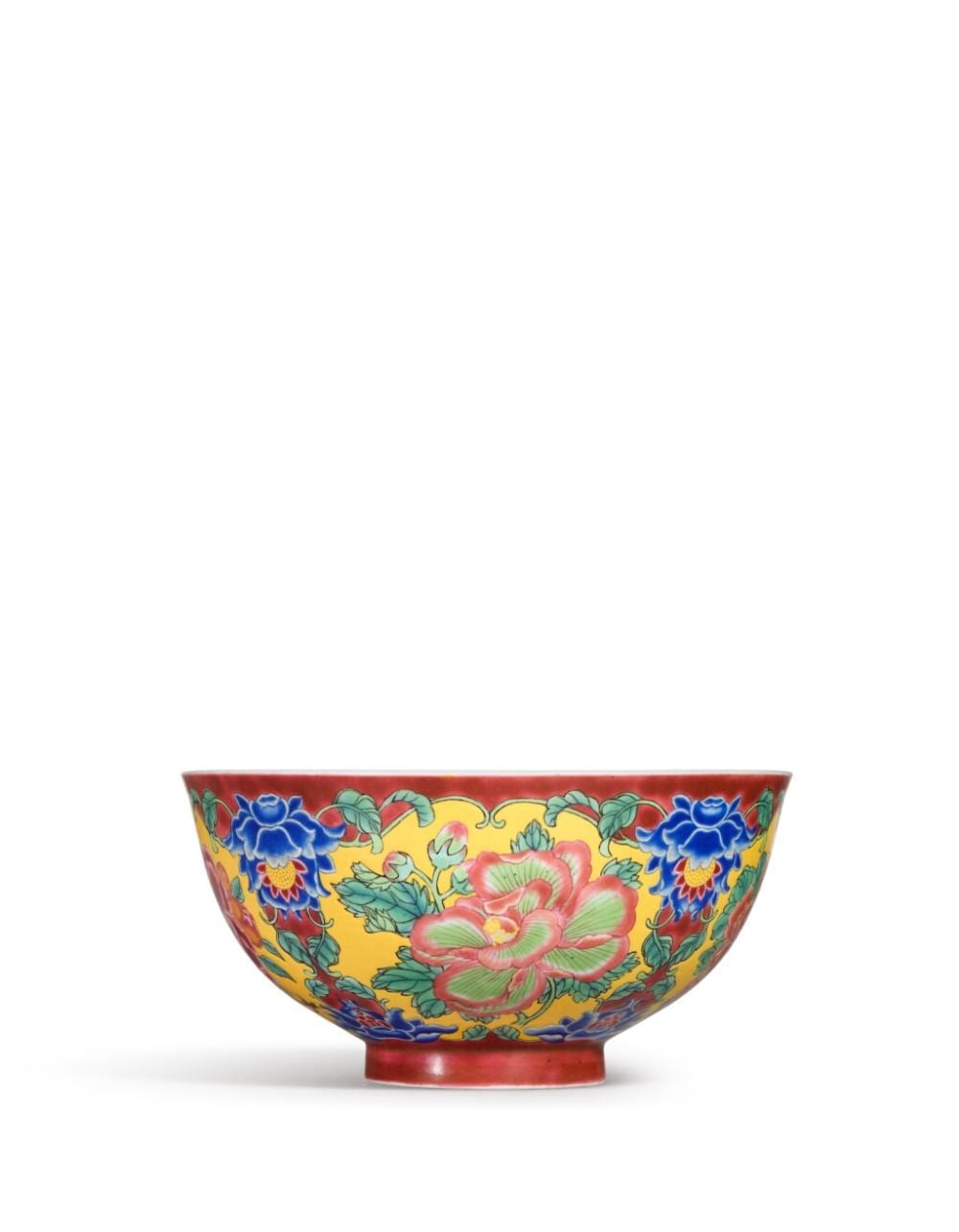 A fine and exceptionally enamelled ruby-ground falangcai 'floral' bowl, Blue-enamel yuzhi mark and period of Kangxi | 清康熙　琺瑯彩胭脂紫地開光花卉紋盌 《康熙御製》藍料款 comparable sale