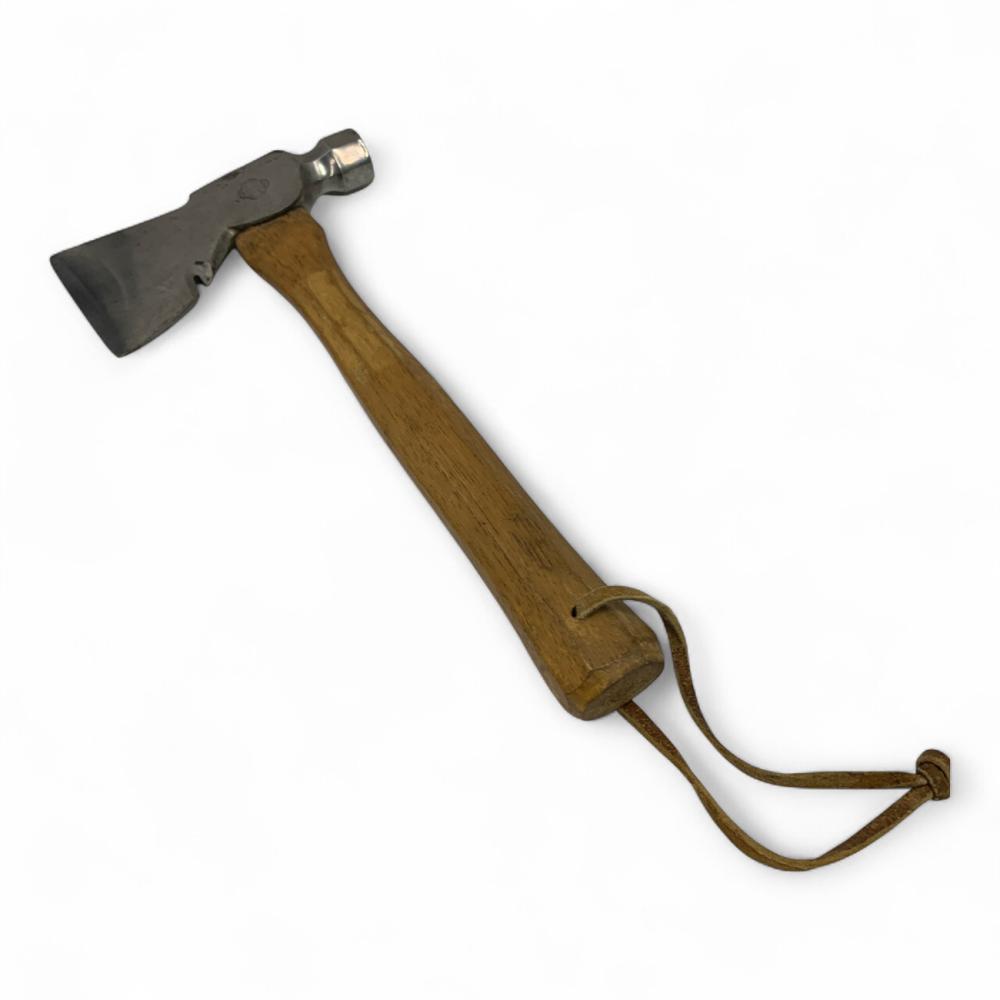 Vintage carpenter’s hatchet with a dark metal head and wooden handle, shown on a white background with a leather lanyard.