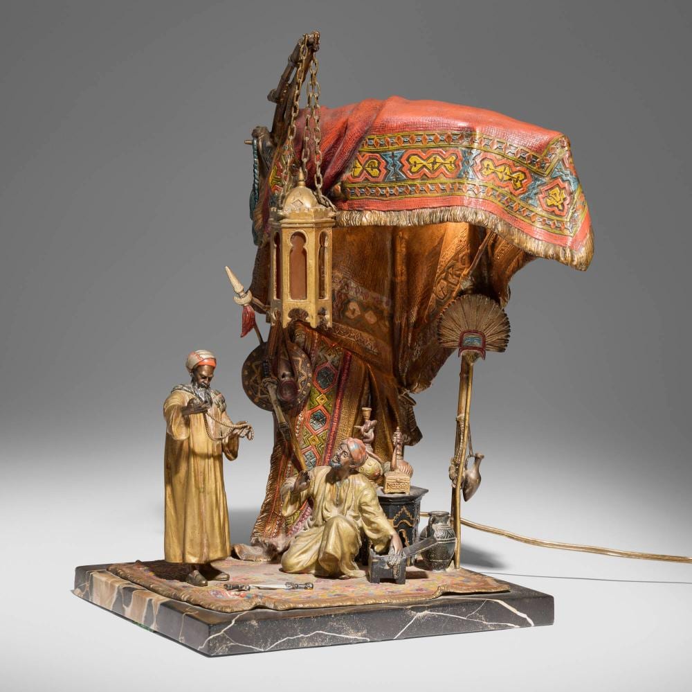 A. Chotka comparable auction result: anton chotka orientalist figural table lamp with merchant and shopper