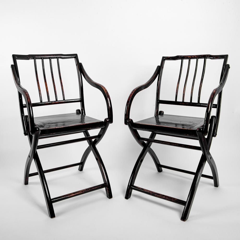A Pair of Chinese Black Lacquered Old Wooden Folding Armchairs sold by Webb’s – Specialist Auctioneers, lot 127 — auction record photograph