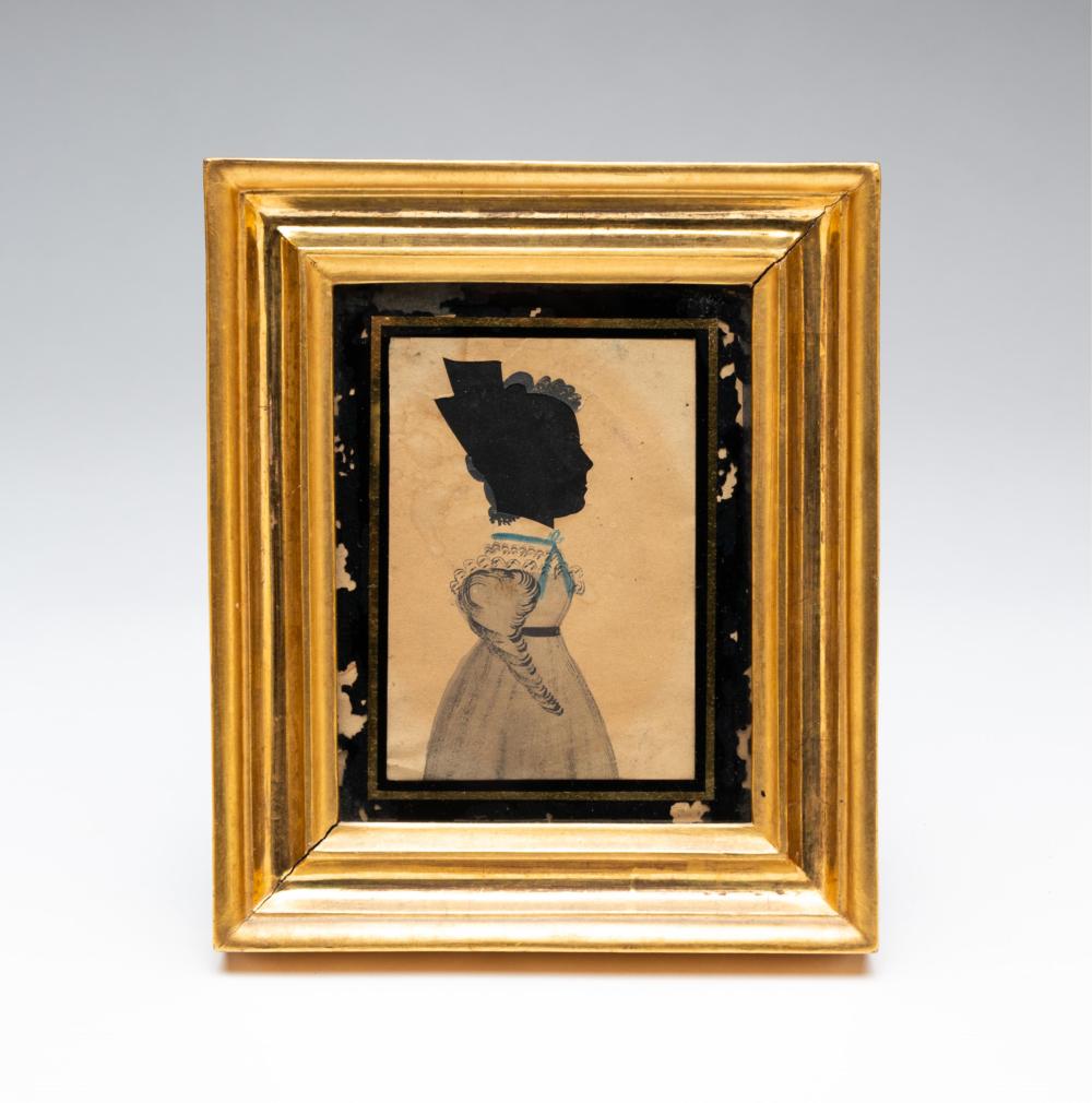 Framed silhouette portrait of a girl in a black cutout profile with a white dress on a light background.