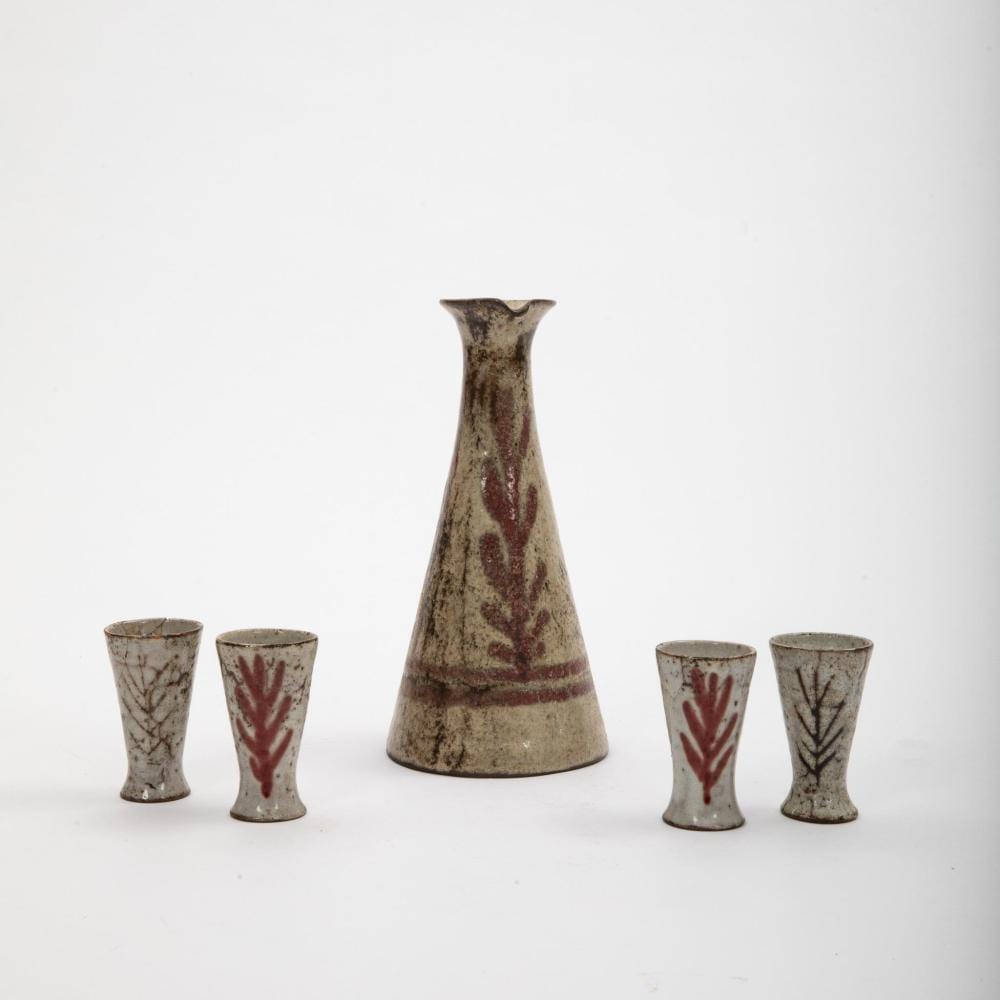 Gustave Reynaud comparable auction result: gustave reynaud 1915 1972 atelier du m rier vallauris partie de service liqueur en c ramique maill e beige en gr s de fleurs et de feuillages stylis s sur fond gris ocre