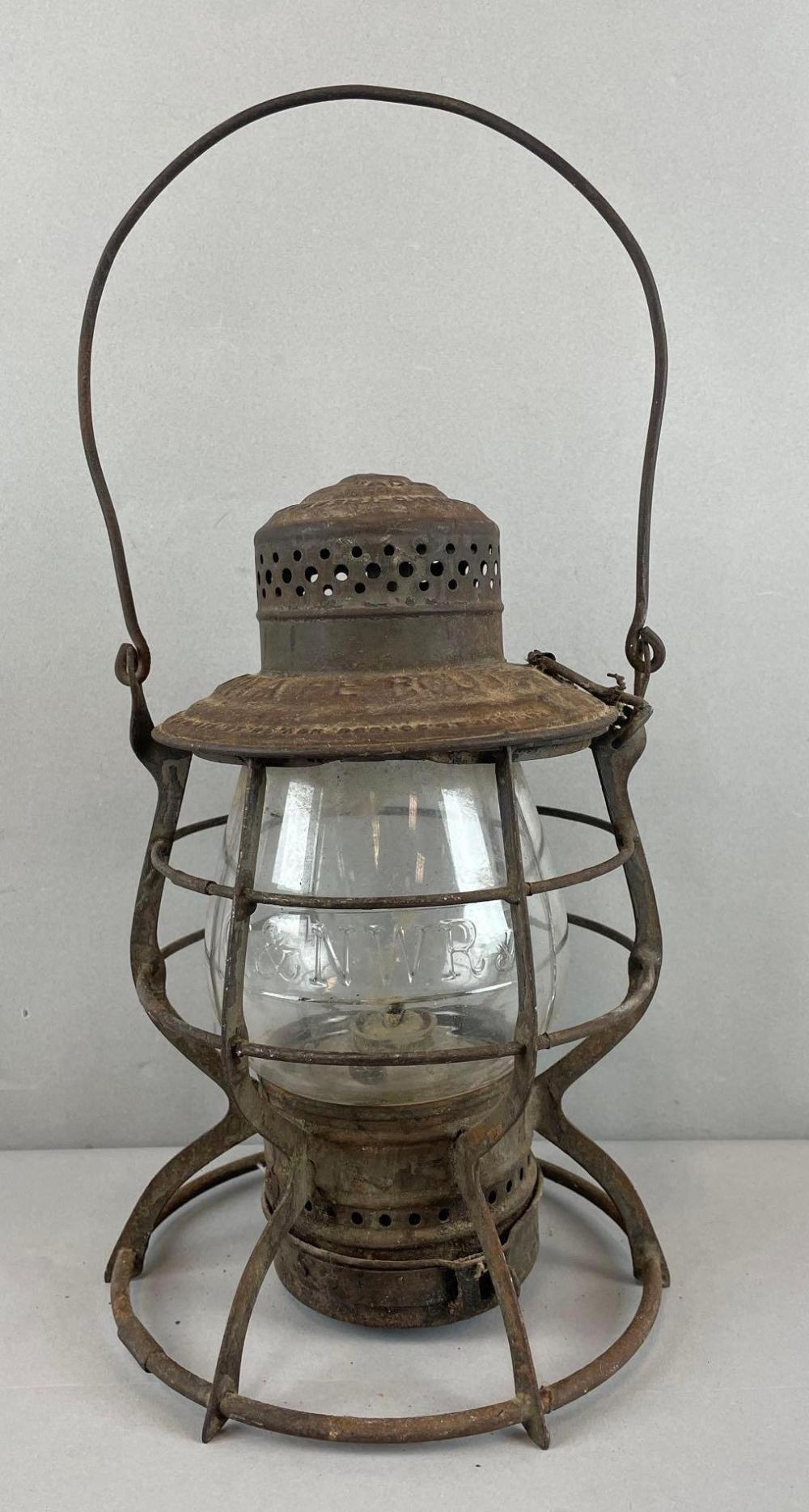 Auction comp thumbnail for Antique Adlake The Adam's Santa Fe Route Kerosene Railroad Lantern (Matthew Bullock Auctioneers, Lot 752)