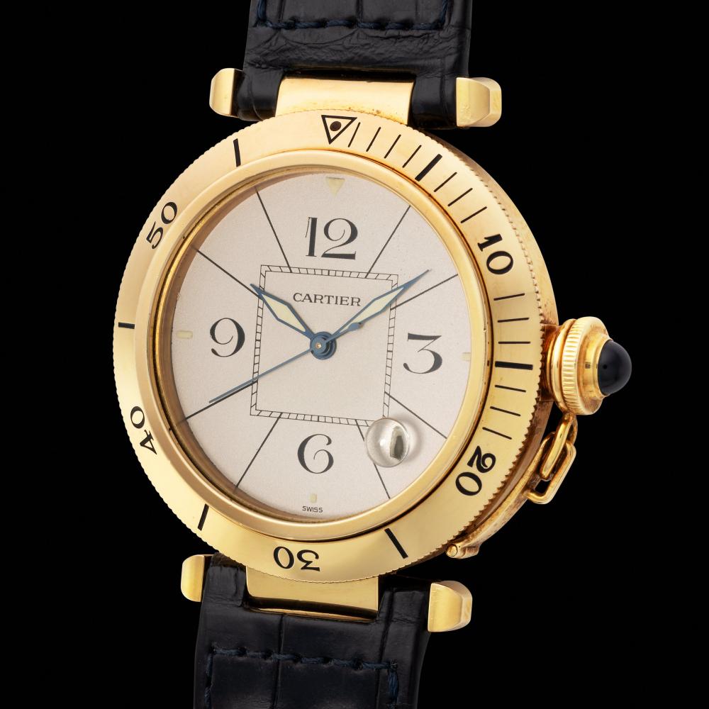 Cartier. A fine and charming, Pasha, automatic wristwatch in yellow gold, with silvered dial, reference 1989 sold by Monaco Legend Auctions, lot 7 — auction record photograph