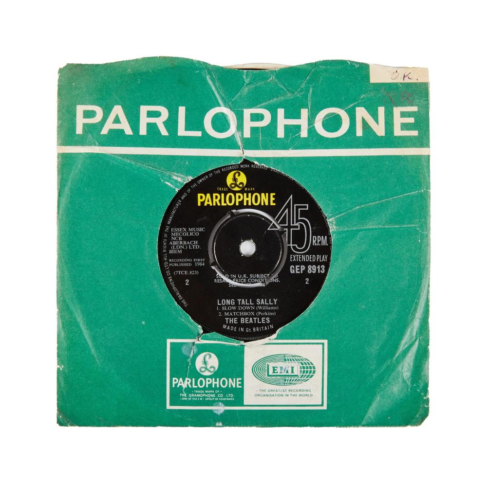 Green Parlophone 45 RPM vinyl record sleeve featuring a small record label graphic and text around the center hole.