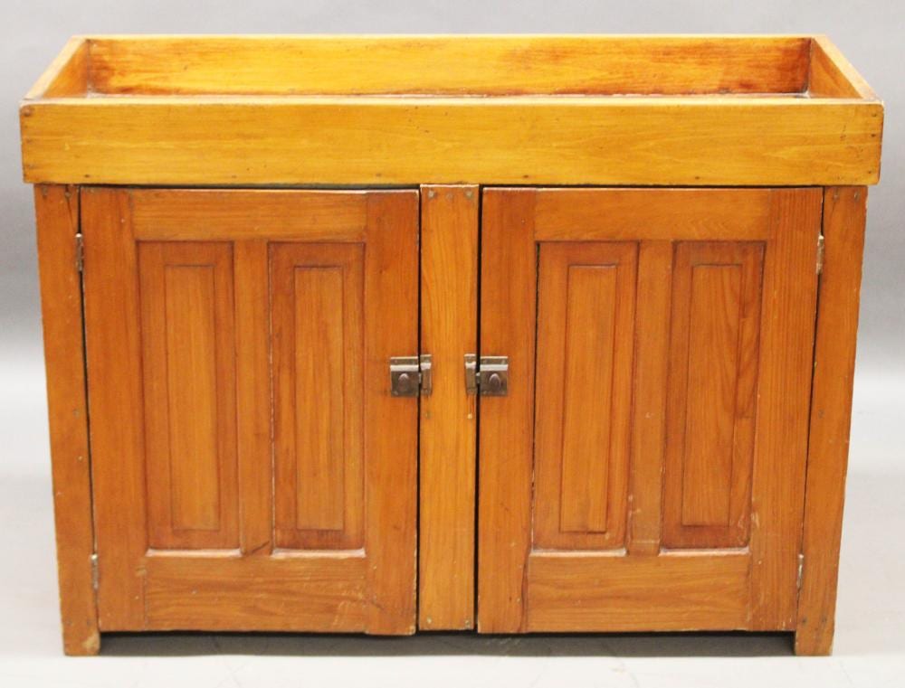 Furniture – NO SHIPPING – Antique dry sink; softwood double blind door base; unlined; painted light green interior; old refinish; 46” W X 19 ½” D X 33” T (Good) NO SHIPPING sold by Roan Inc. Auctioneers & Appraisers, lot 330 — auction record photograph
