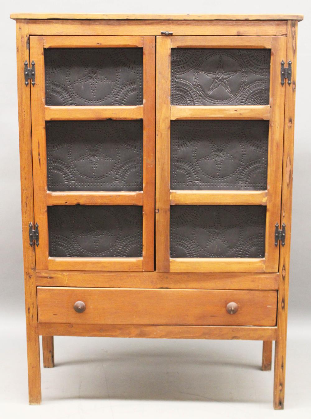 Furniture- NO SHIPPING – Antique pie safe; softwood with long bottom drawer and double pierced tin panel doors top; pierced tin sides; two shelves interior; old natural refinish & later painted black sold by Roan Inc. Auctioneers & Appraisers, lot 390 — auction record photograph