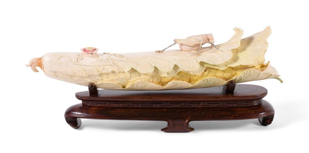 JAPANESE OR CHINESE PAINTED IVORY MODEL OF A CABBAGE AND INSECT, CIRCA 20TH CENTURY Length: 12 in. (30.5 cm.) sold by Potomack Company, lot 1191 — auction record photograph