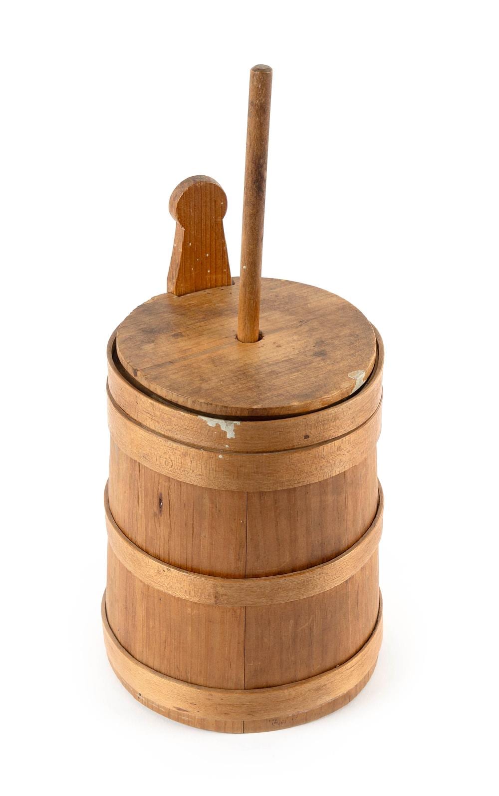 Small wooden butter churn with a lid and vertical dasher handle, shown against a white background.