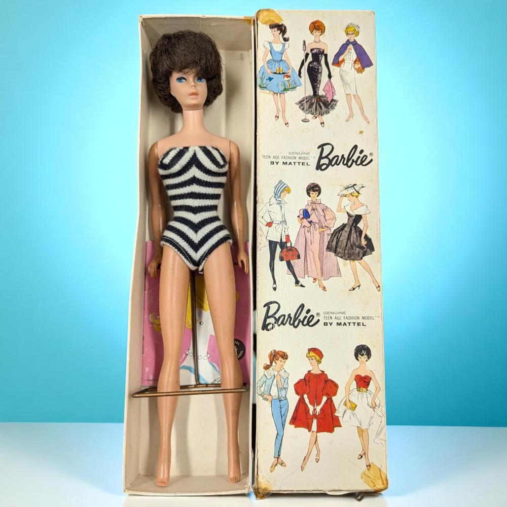 Auction comp thumbnail for Vintage Mattel Brownette Bubble Cut Barbie Doll In Original Box With Stand, 1961 (Compendium Auction House, Lot 2)