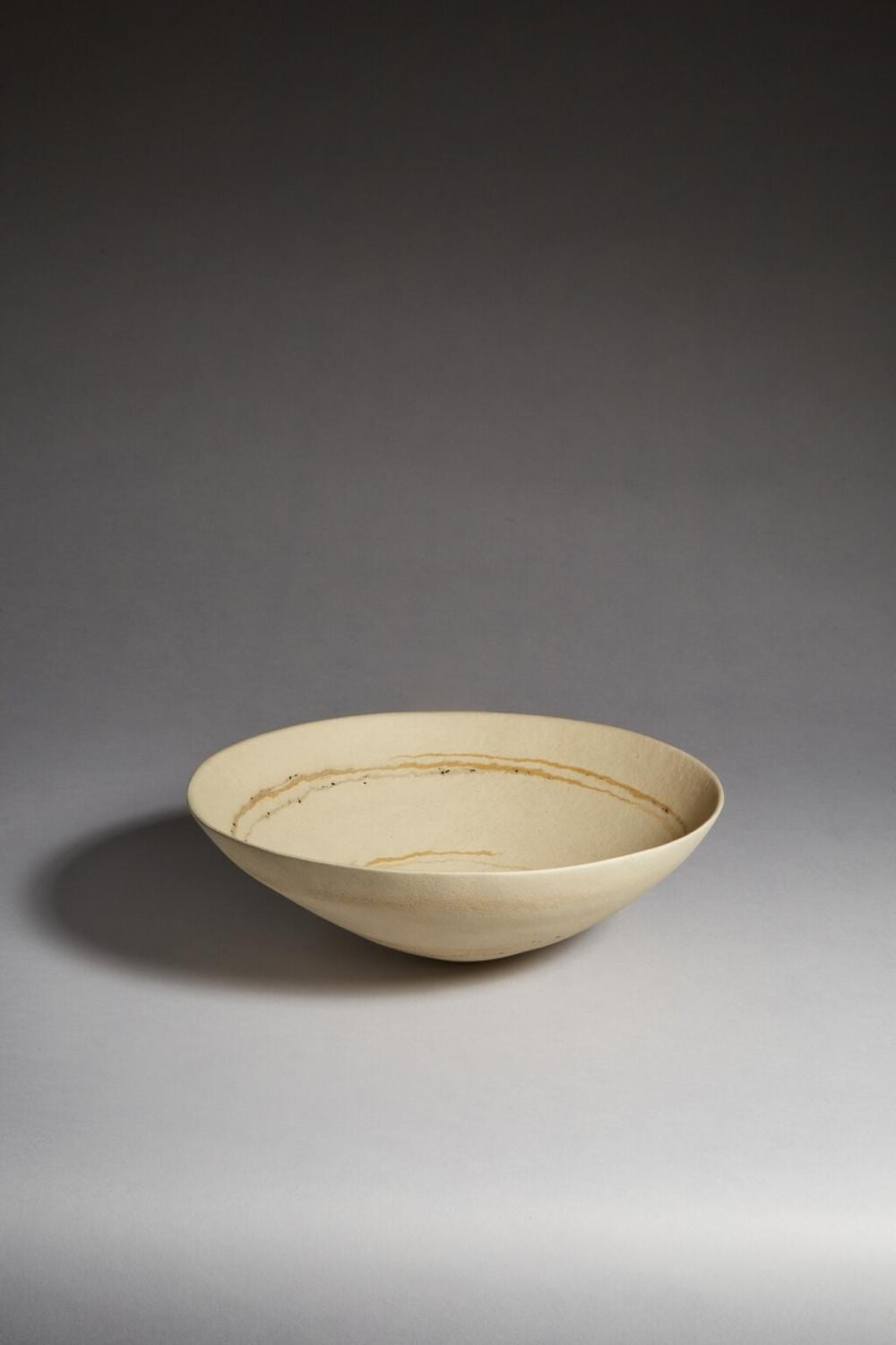 Jennifer Lee comparable auction result: large open pale bowl with amber spangled and specked bands