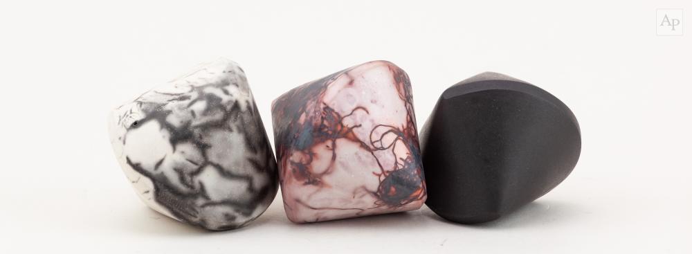 Eric Moss comparable auction result: eric moss born 1959 a trio of grey and white naked raku pink and white ferric saggar fired raku and black stoneware sphericon sculptures impressed marks tallest 8cm 3