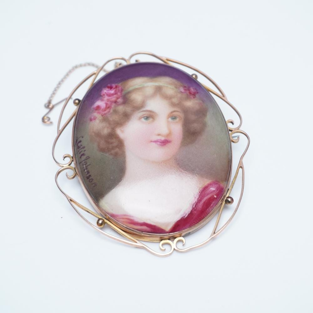 Leslie Johnson comparable auction result: 9k gold hand painted portrait brooch by leslie johnson