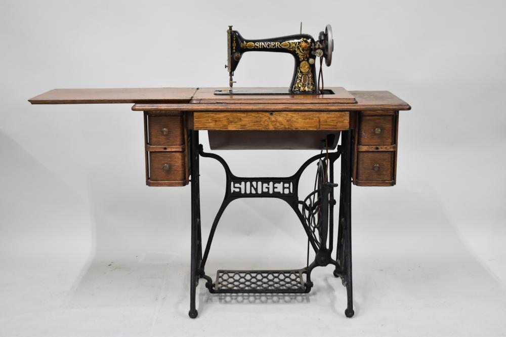 Antique Singer Sewing Machine in Oak Case sold by Nye & Company, lot 506 — auction record photograph