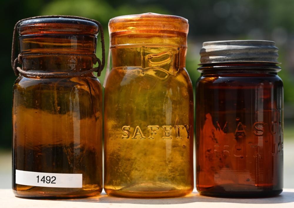 Auction comp thumbnail for Antique Mason Safety Putnam Amber Glass Fruit Jar Collection (Mebane Antique Auction, Lot 648)