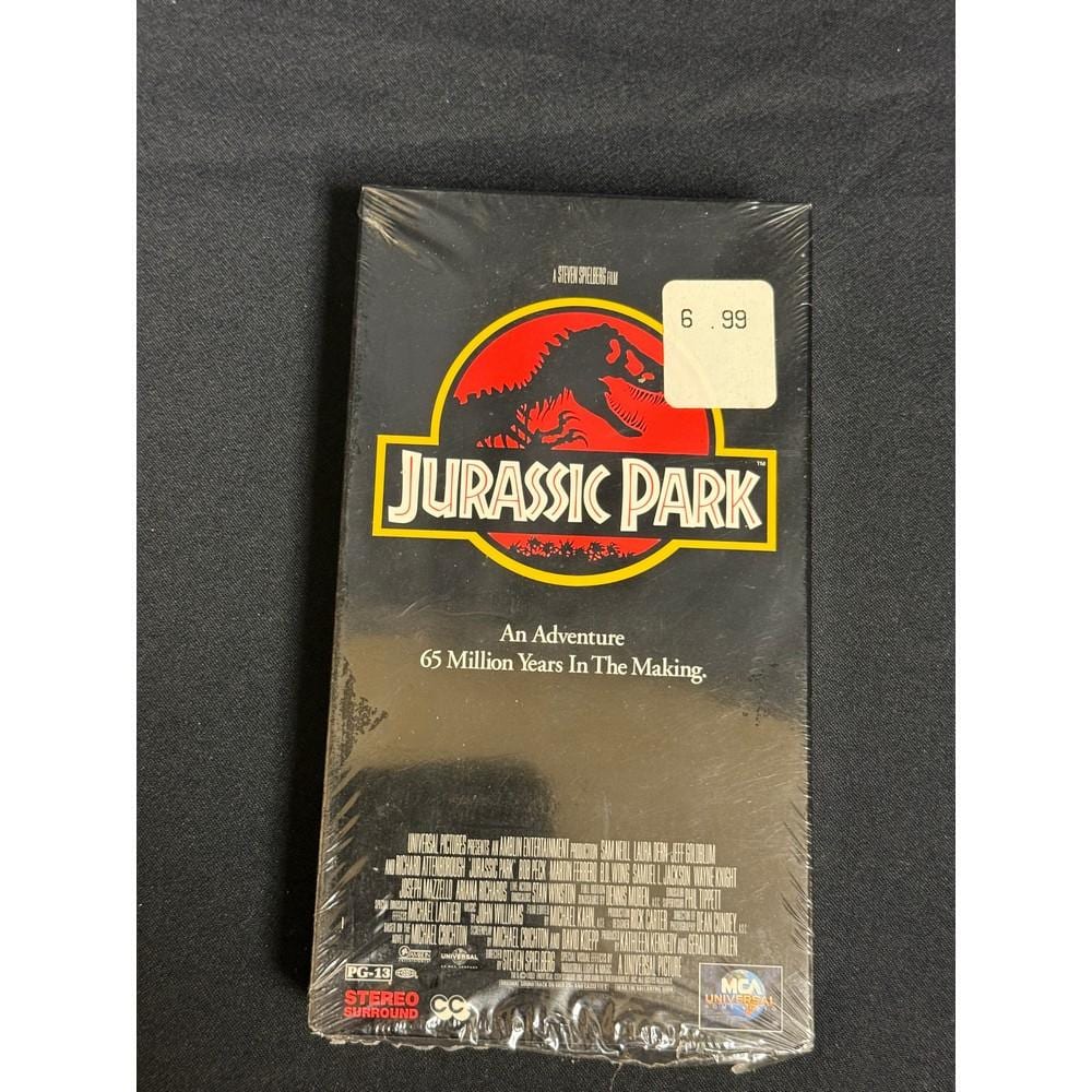 Sealed Jurassic Park VHS tape package with a red dinosaur logo and yellow title text on the front.