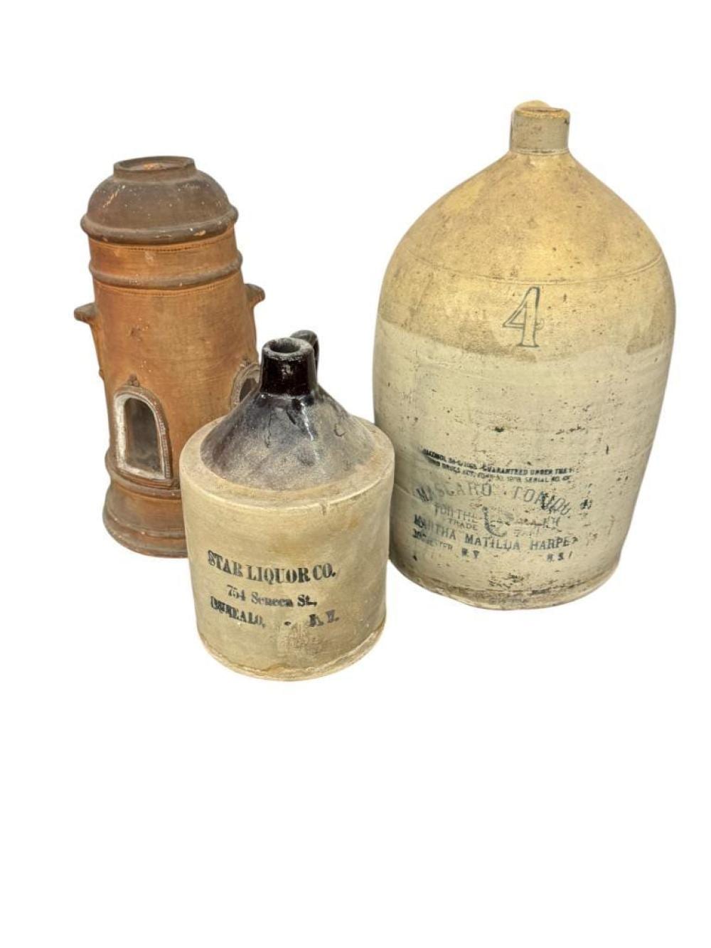 Whiskey Jugs and Terracotta Lighthouse sold by Schultz Auctioneers, lot 959 — auction record photograph