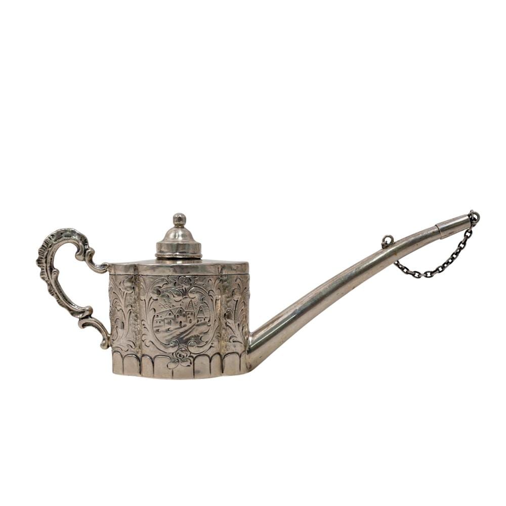 Antique-style silver table lighter shaped like a small watering-can with an engraved front panel and a long spout with chain pull.