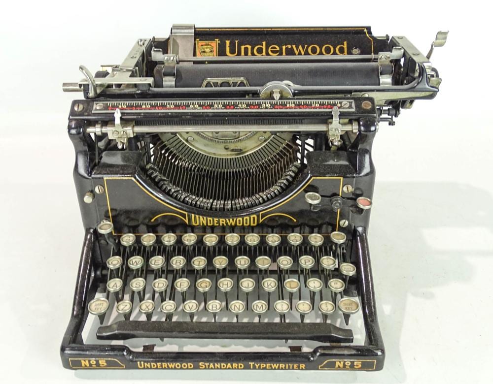 Front view of a vintage Underwood typewriter with the Underwood name visible on the carriage and front panel.