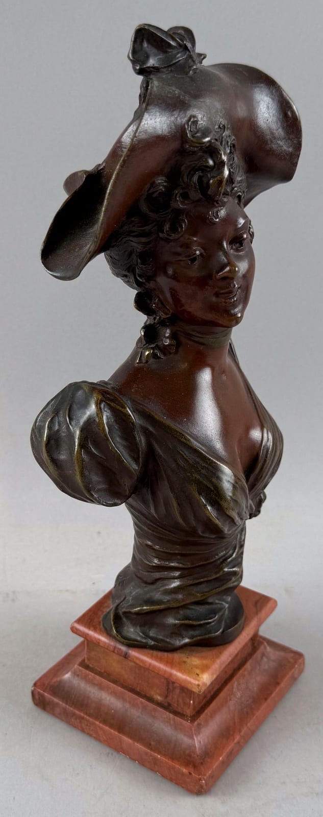 Marcel Debut comparable auction result: marcel debut france 1865 1933 bust of a lady bronze on a rouge marble base height 10 25 base 3 25 x 3 375