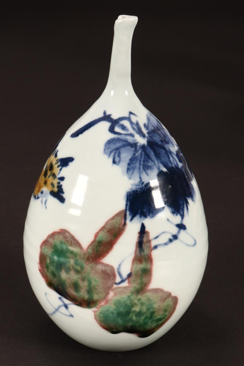 A narrow-necked vase painted with birds and flowers, in an auction photograph.