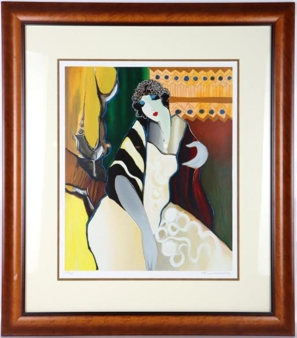 Framed colorful print showing a curly-haired woman in a white dress reclining beside a stylized sailboat shape in the background.