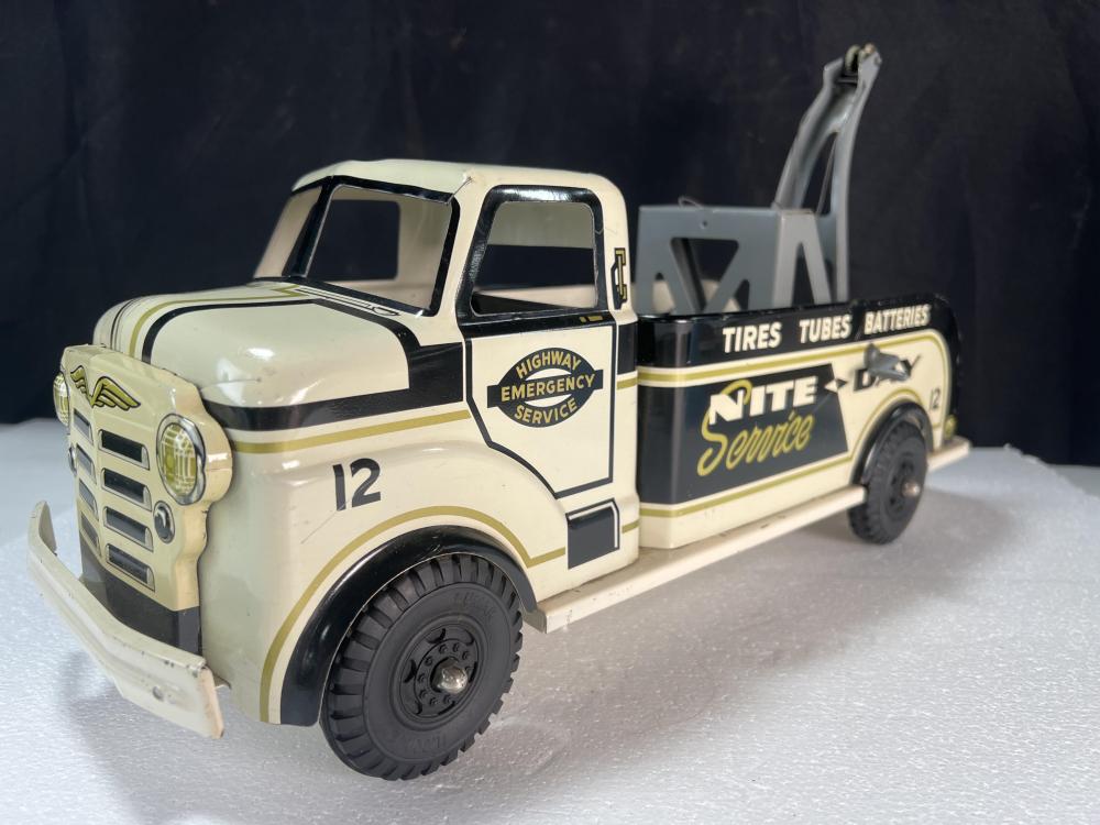 Auction comp thumbnail for Vintage Marx toys Nite & Day Service Wrecker Tow Truck, a collectible pressed steel toy truck. (Ripley Auctions, Lot 8815)