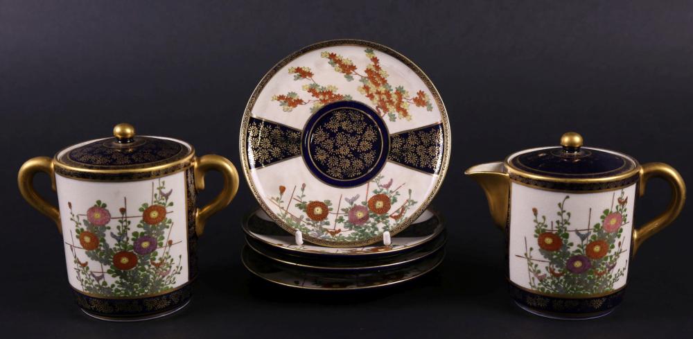 Auction comp thumbnail for A Japanese Satsuma porcelain tea set on royal blue ground, with allover finely hand painted floral and gilt decoration. Consisting of teapot, lidded sugar bowl and saucers. Signed to base. H 10cm D 11cm. (Lawsons, Lot 55)