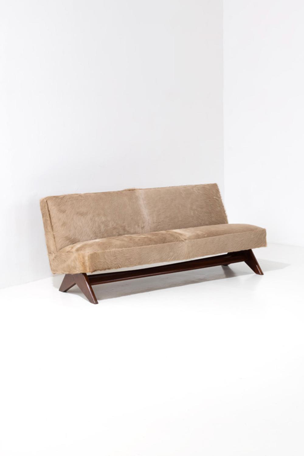 xx Pierre Jeanneret (1896-1967) 'Fireside' sofa Teak and hide Painted inventory numbers 'P sold by Piasa, lot 198 — auction record photograph