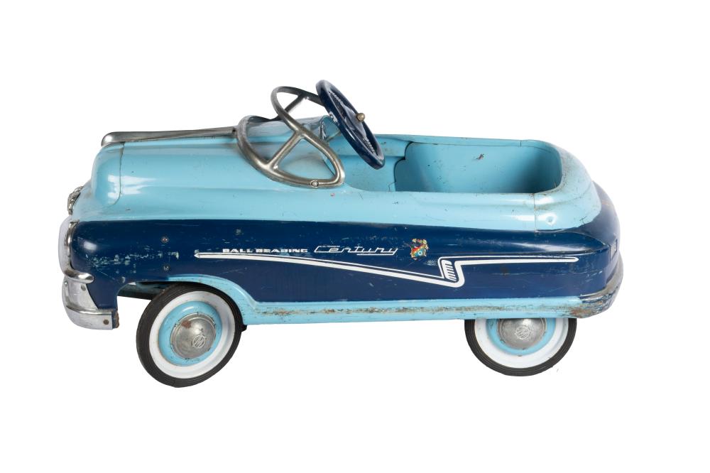 Small pedal toy car in light blue and dark blue with whitewall wheels, viewed from the left side.