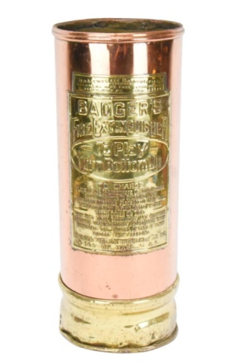 Antique-style copper and brass fire extinguisher canister with engraved label reading “BACGERS” on a rectangular plaque.